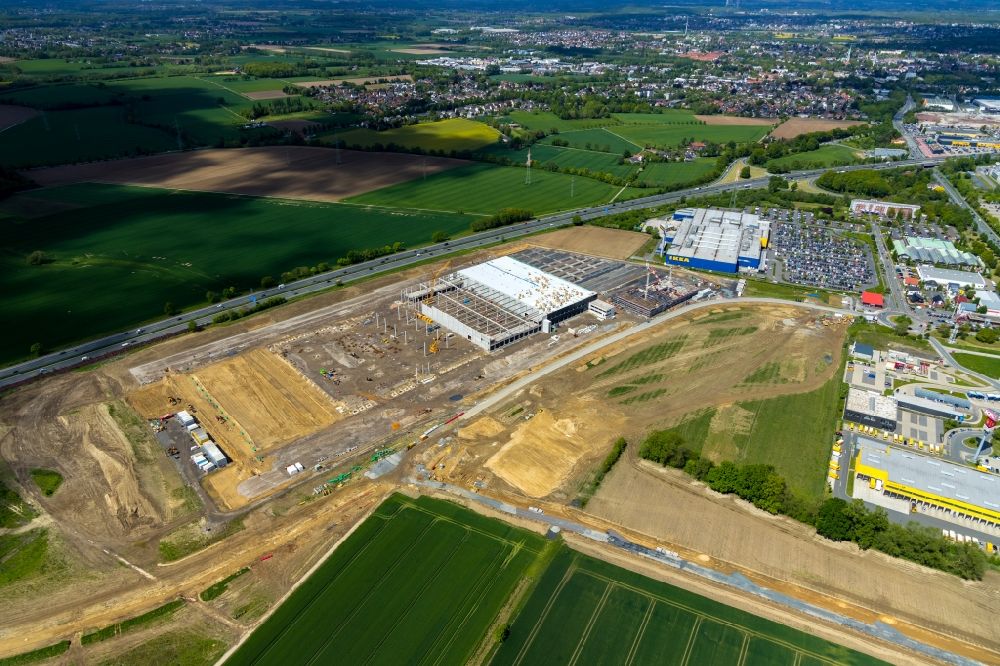 Luftaufnahme Kamen - Baustelle zum Neubau eines Gebäudekomplexes auf dem Gelände des Logistikzentrums der Woolworth GmbH im Gewerbegebiet in Kamen im Bundesland Nordrhein-Westfalen, Deutschland