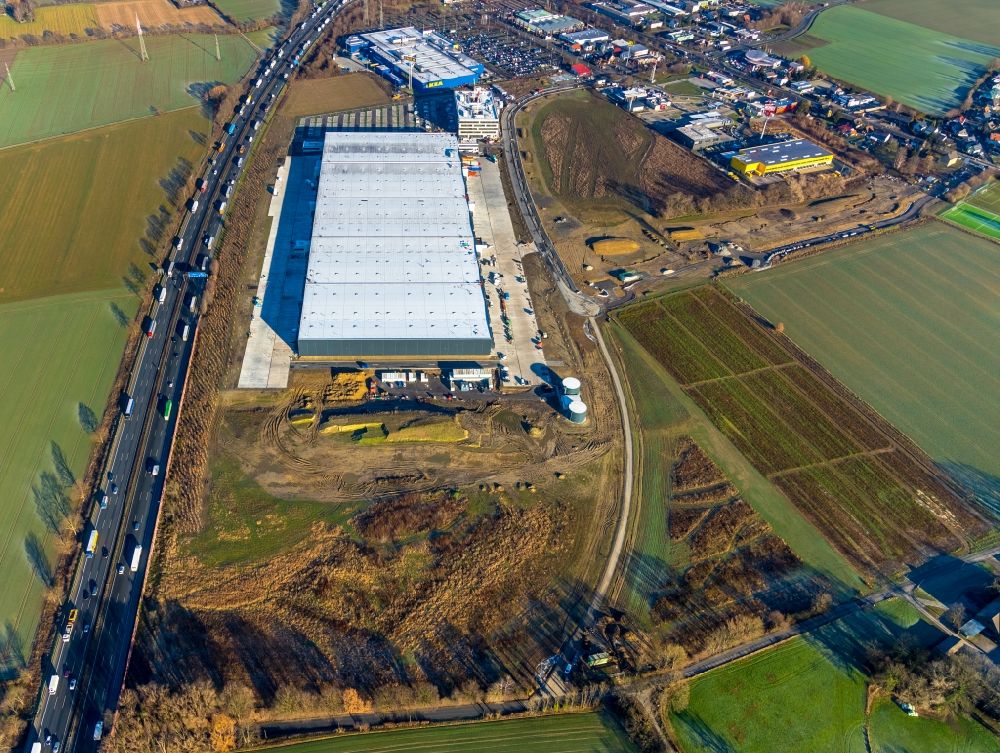 Luftbild Unna - Baustelle zum Neubau eines Gebäudekomplexes auf dem Gelände des Logistikzentrums der Woolworth GmbH im Gewerbegebiet in Kamen im Bundesland Nordrhein-Westfalen, Deutschland