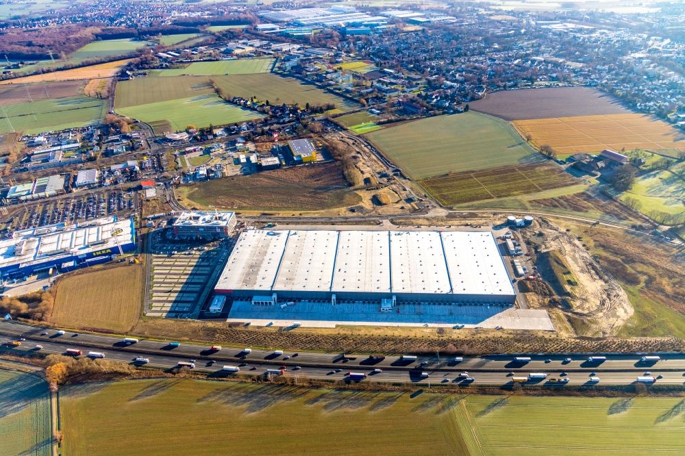 Luftbild Unna - Baustelle zum Neubau eines Gebäudekomplexes auf dem Gelände des Logistikzentrums der Woolworth GmbH im Gewerbegebiet in Kamen im Bundesland Nordrhein-Westfalen, Deutschland