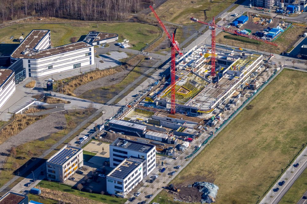 Dortmund von oben - Neubau eines Büro- und Geschäftshauses an der Robert-Schuman-Straße in Dortmund im Bundesland Nordrhein-Westfalen, Deutschland
