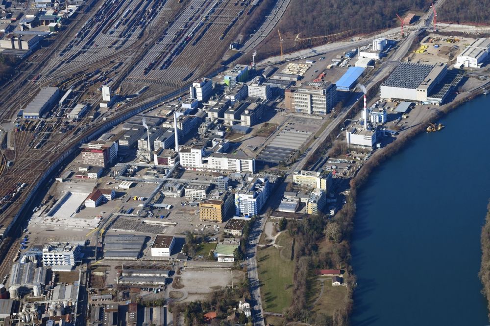 Luftaufnahme Muttenz - Standort des Industrieparks Infrapark-Baselland AG am Rhein in Muttenz im Kanton Basel-Landschaft, Schweiz
